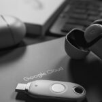Black and white tech scene featuring a USB device and Google Cloud logo, embodying digital connectivity.